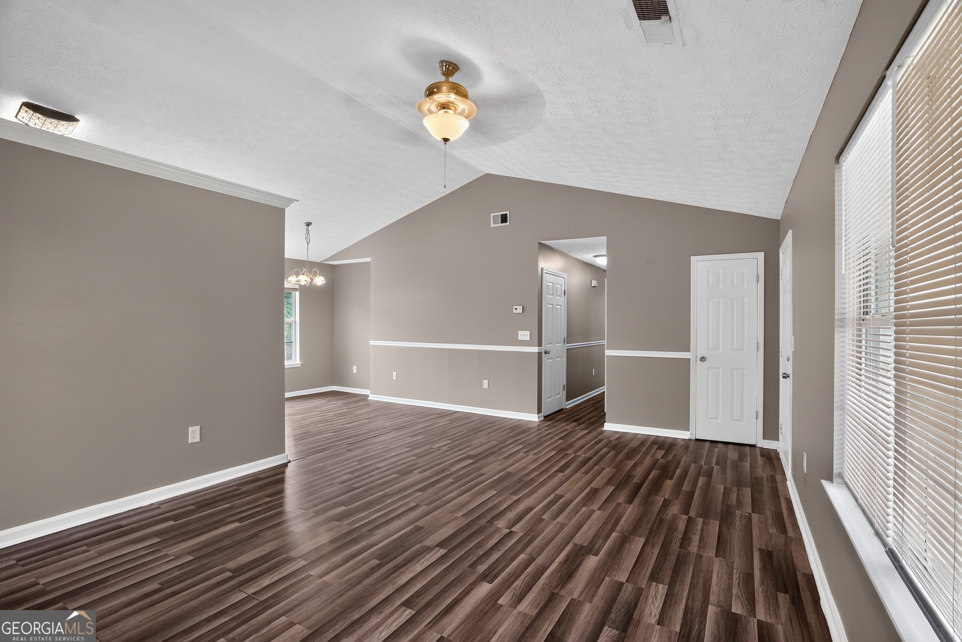 75 Linsley Way Covington, GA 30016 - Photo 23 of 48 wooden floor in an empty room with a window