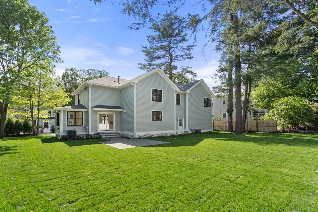 30 Asheville Road Newton, MA 02462 - Photo 14 of 16 a front view of a house with a garden
