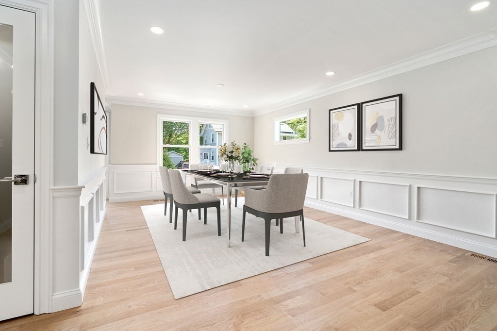 30 Asheville Road Newton, MA 02462 - Photo 6 of 16 a view of a livingroom with furniture a fireplace and wooden floor