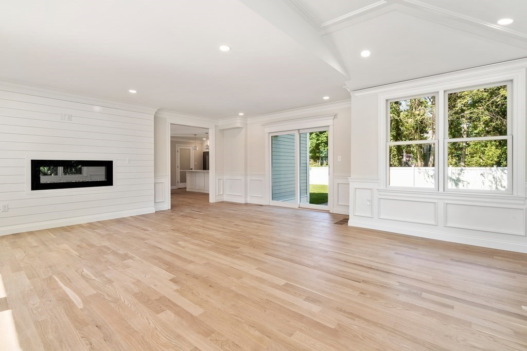30 Asheville Road Newton, MA 02462 - Photo 8 of 16 a view of an empty room with a window and wooden floor