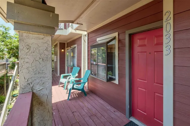 a view of a house with a table and chairs