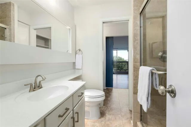 a bathroom with a double vanity sink and mirror