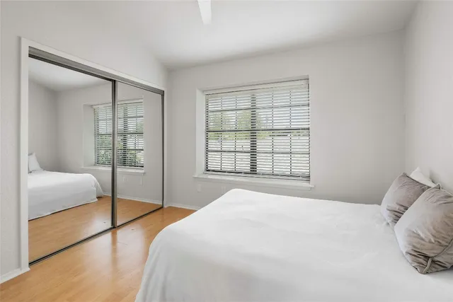 a bedroom with a bed and a view of bathroom