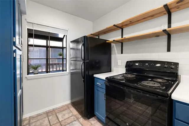 a balcony with table and chairs