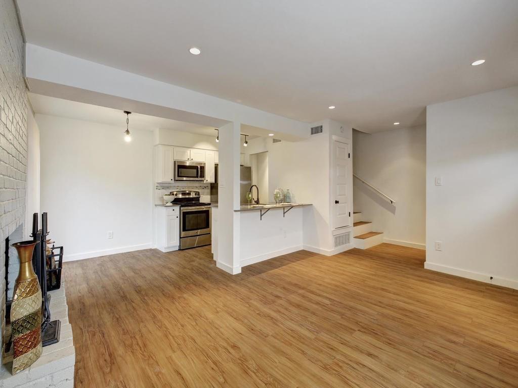 3500 Alpine Circle, Unit 1 Austin, TX 78704 - Photo 13 of 20 a view of kitchen with kitchen island a sink wooden floor and stainless steel appliances