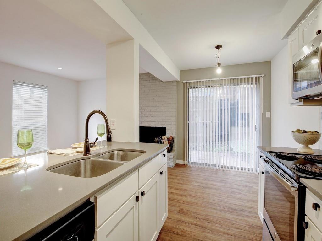3500 Alpine Circle, Unit 1 Austin, TX 78704 - Photo 15 of 20 a kitchen with a sink appliances and cabinets