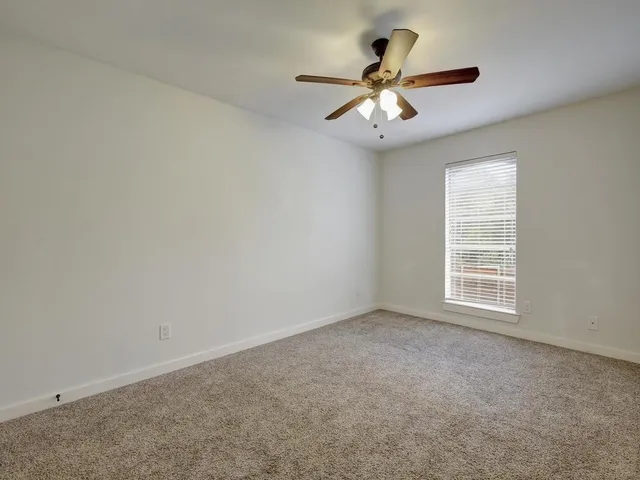 a kitchen with a sink appliances and cabinets
