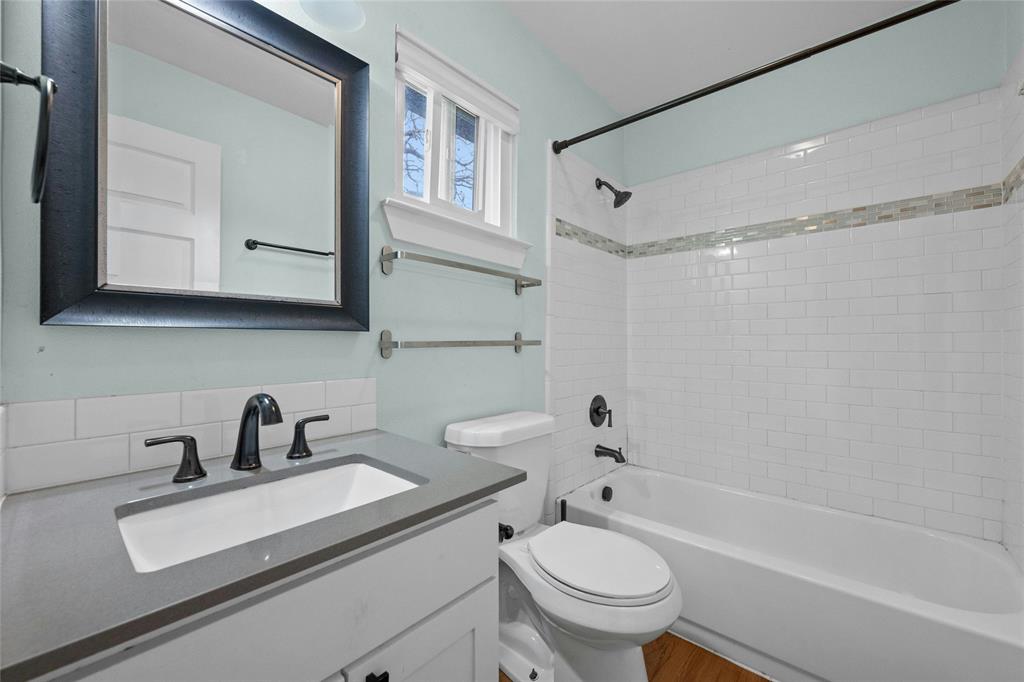 3500 Alpine Circle, Unit 1 Austin, TX 78704 - Photo 9 of 20 a bathroom with a sink a toilet and a bathtub