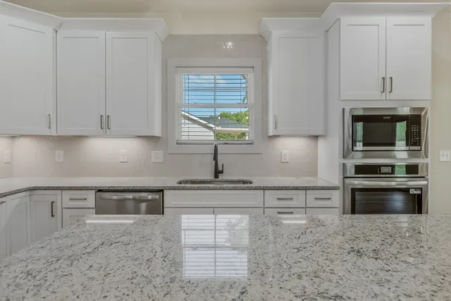 a view of a kitchen with microwave and stove