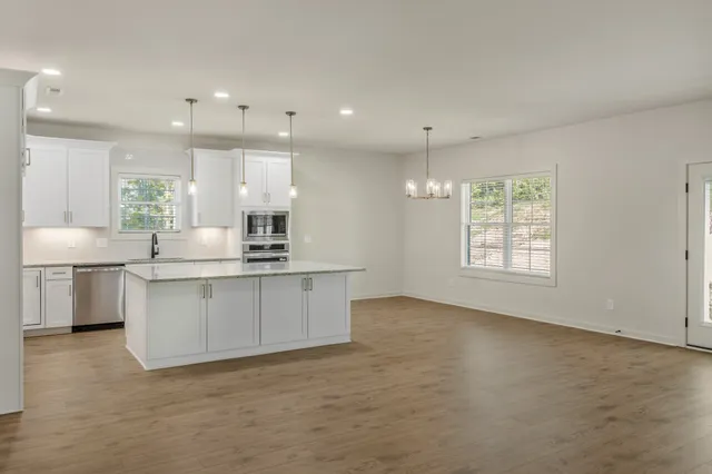 a view of a kitchen with a sink and a stove
