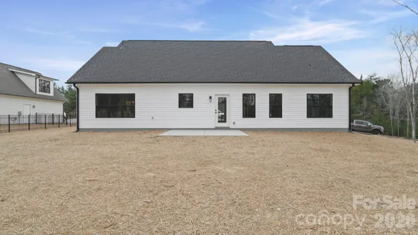 a house that has a tree in front of it