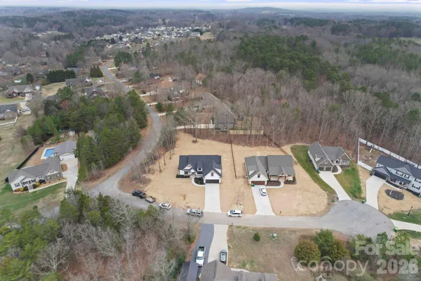 an aerial view of a house with outdoor space