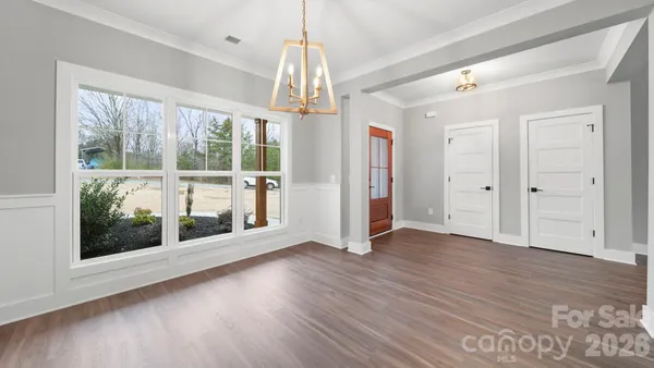 a view of kitchen with wooden floor and windows