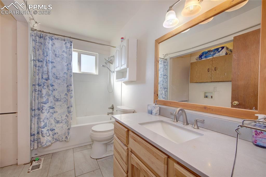 369 G Street Penrose, CO 81240 - Photo 19 of 37 a bathroom with a sink toilet and shower