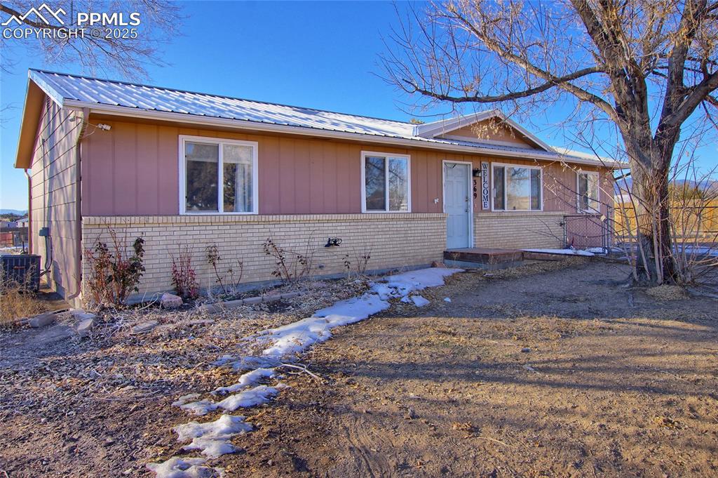 369 G Street Penrose, CO 81240 - Photo 2 of 37 a front view of a house with a yard