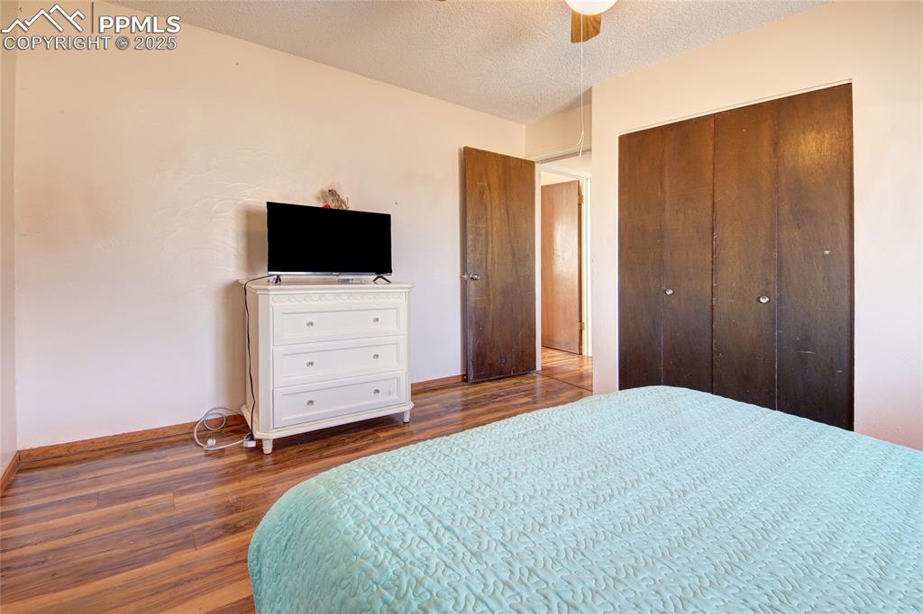 369 G Street Penrose, CO 81240 - Photo 23 of 37 a bedroom with a bed and flat screen tv