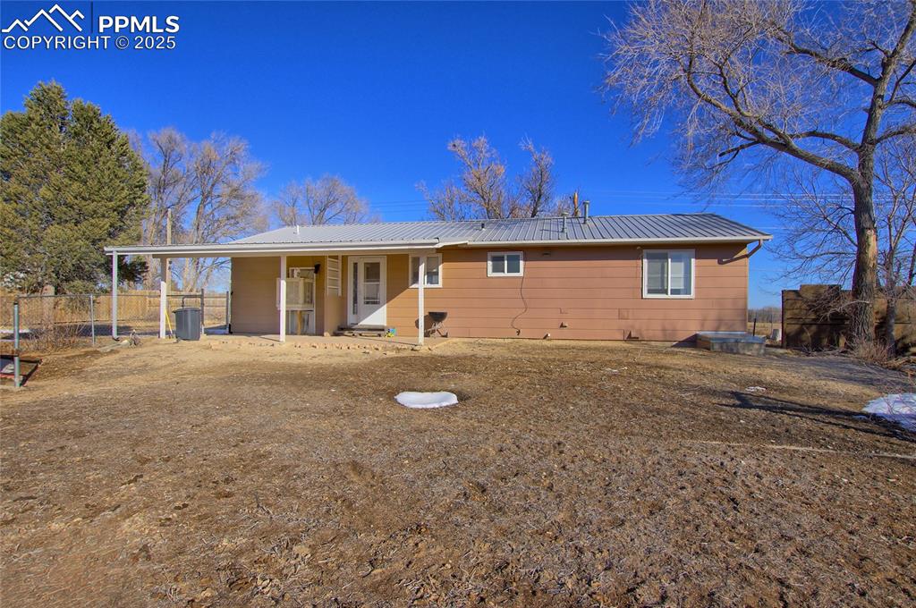 369 G Street Penrose, CO 81240 - Photo 24 of 37 a front view of a house with a yard
