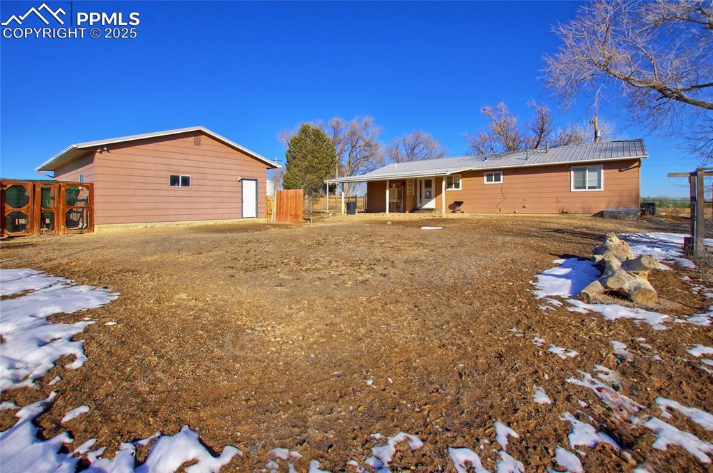 369 G Street Penrose, CO 81240 - Photo 25 of 37 a front view of a house with a yard
