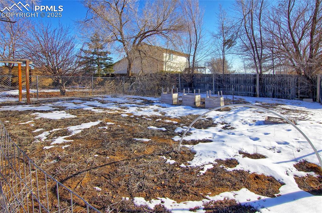 369 G Street Penrose, CO 81240 - Photo 27 of 37 a view of a yard with snow on the road