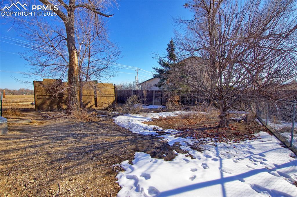 369 G Street Penrose, CO 81240 - Photo 28 of 37 a view of a backyard with large trees