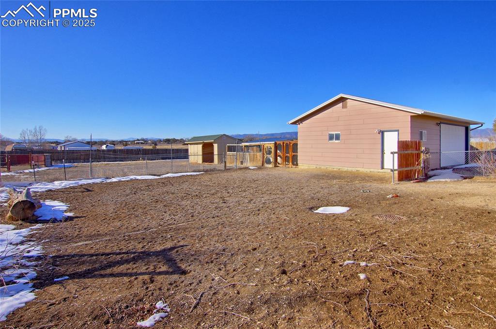 369 G Street Penrose, CO 81240 - Photo 3 of 37 a view of a house with a yard