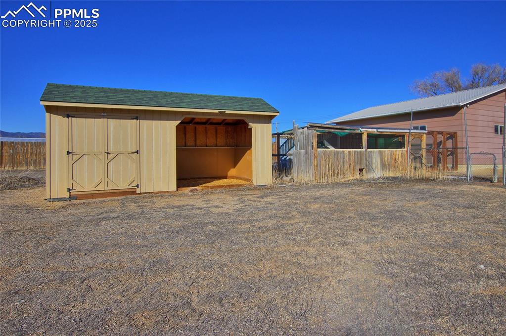 369 G Street Penrose, CO 81240 - Photo 34 of 37 a view of garage with wooden fence