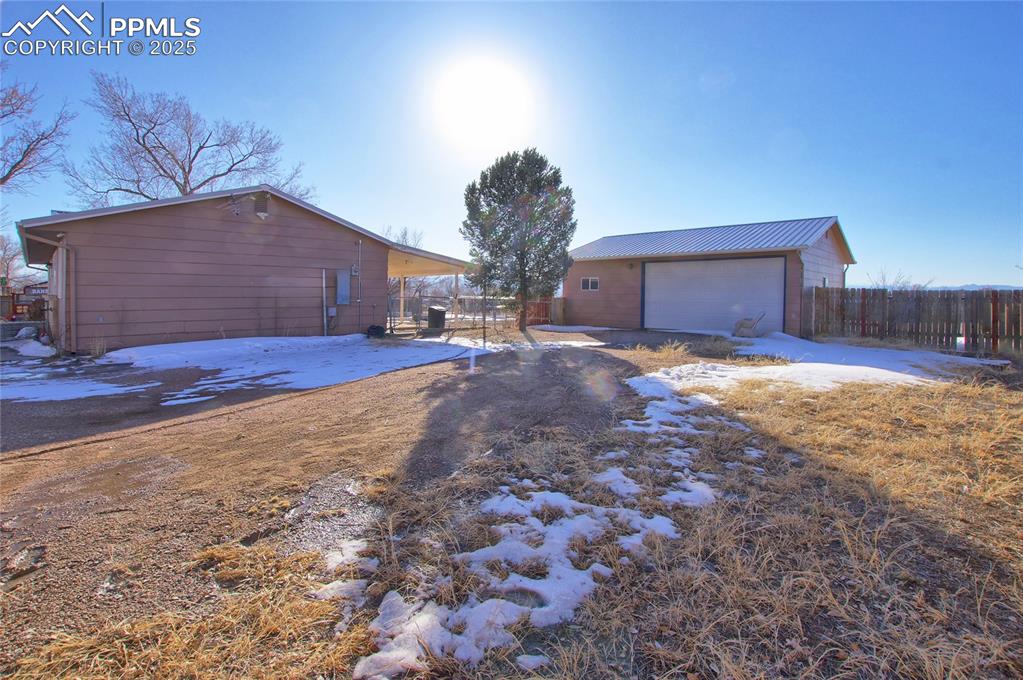 369 G Street Penrose, CO 81240 - Photo 4 of 37 a view of a yard and garage