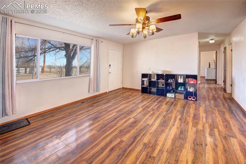 369 G Street Penrose, CO 81240 - Photo 6 of 37 a view of a livingroom with furniture and wooden floor