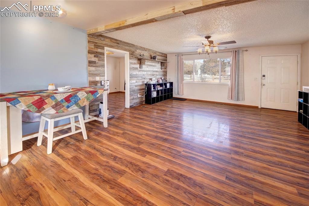 369 G Street Penrose, CO 81240 - Photo 7 of 37 a view of a livingroom with furniture and wooden floor