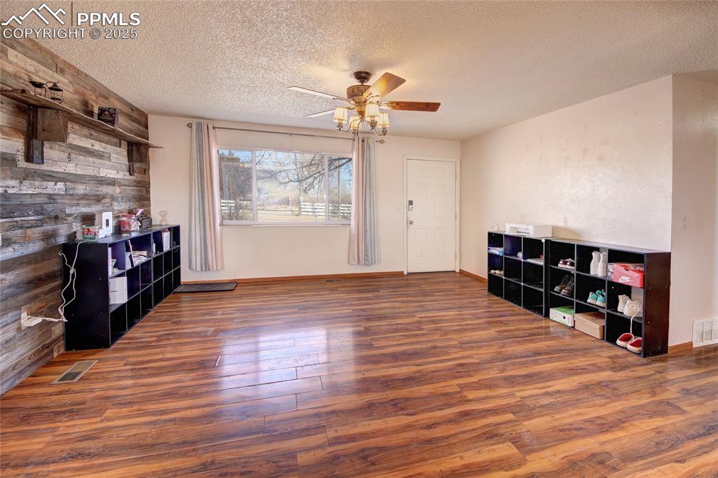 369 G Street Penrose, CO 81240 - Photo 8 of 37 a room with furniture and wooden floor