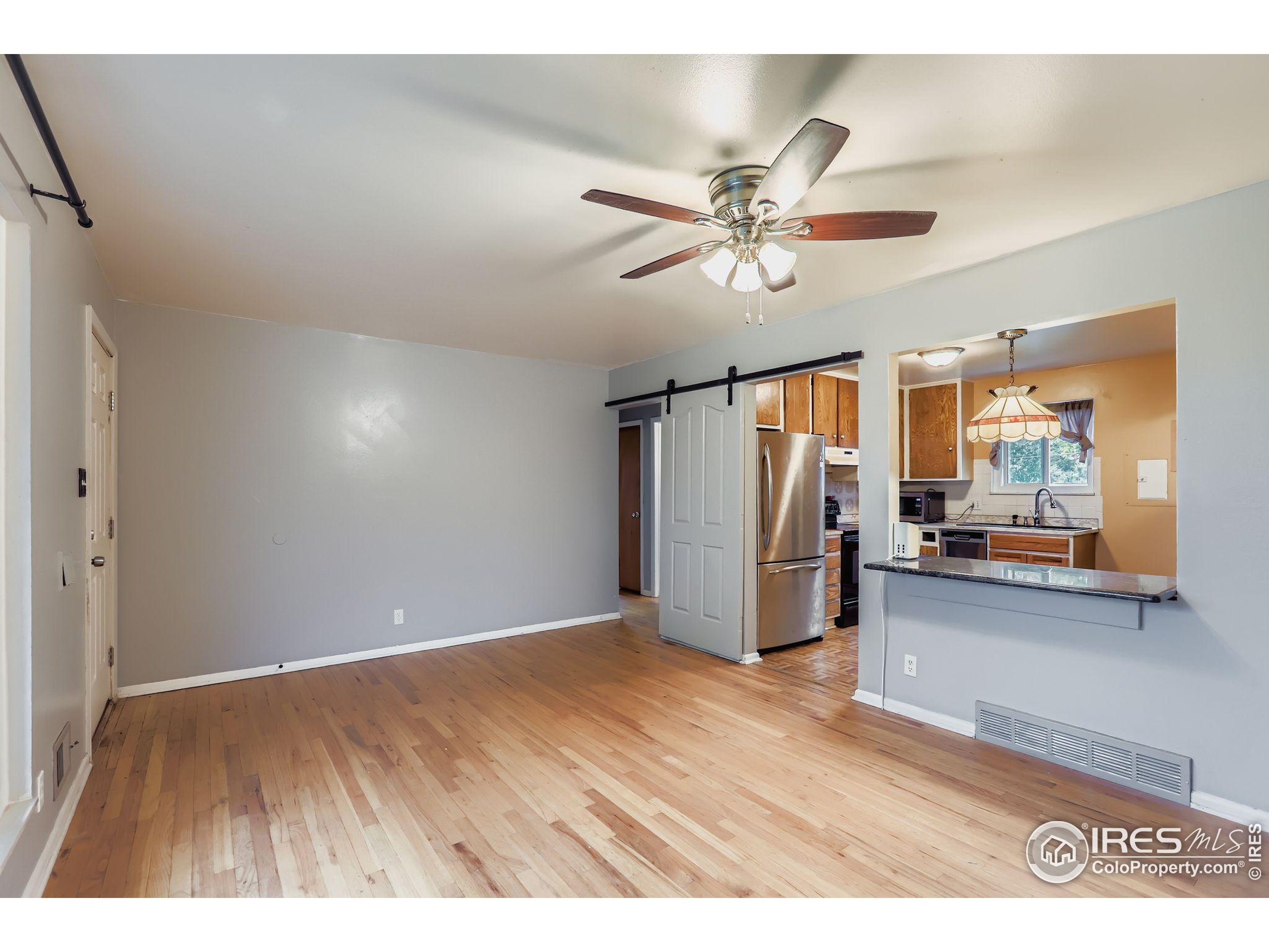 11816 Spring Drive Northglenn, CO 80233 - Photo 2 of 10 a view of an empty room with window