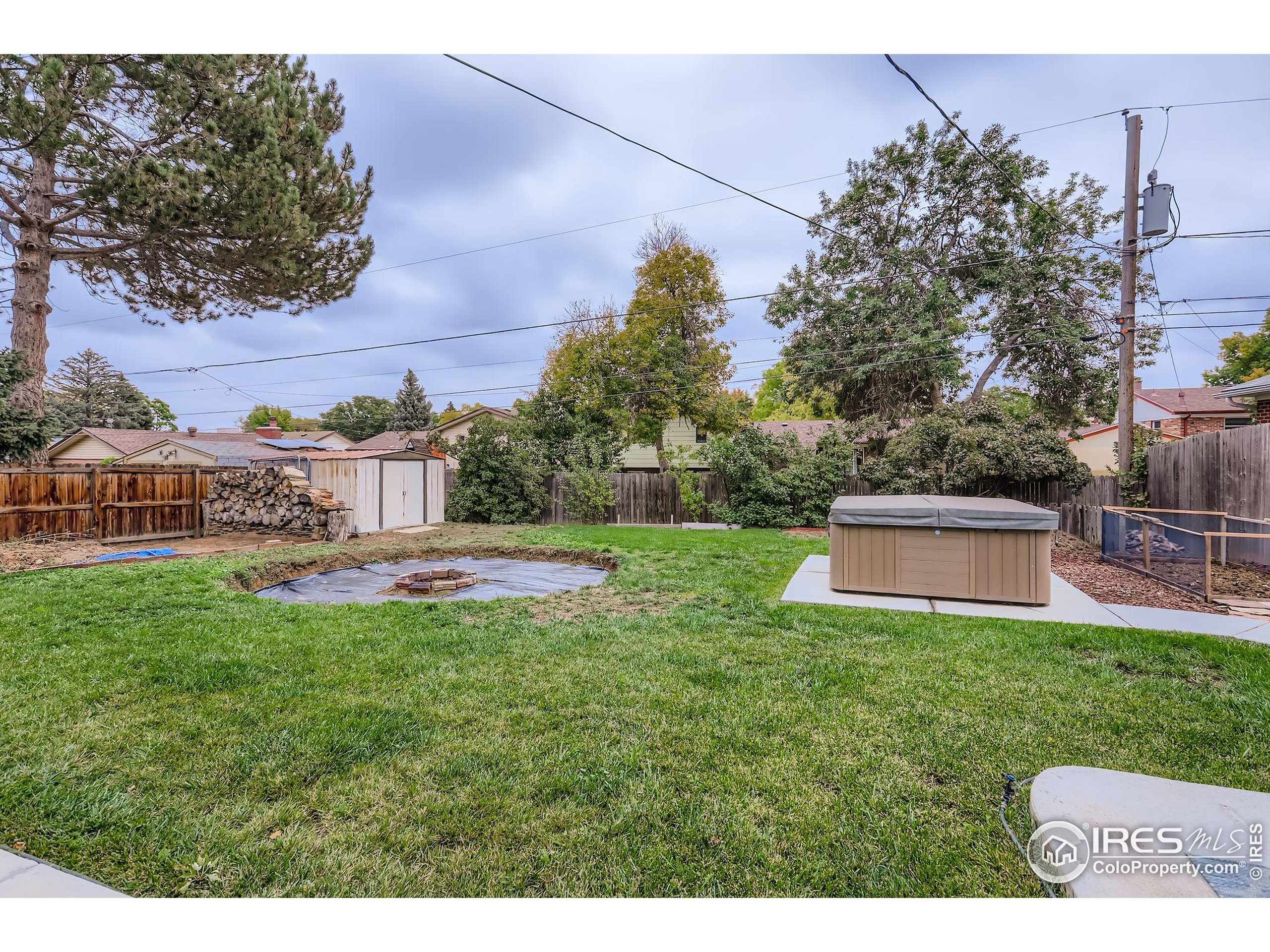 11816 Spring Drive Northglenn, CO 80233 - Photo 10 of 10 a view of a house with a yard porch and sitting area