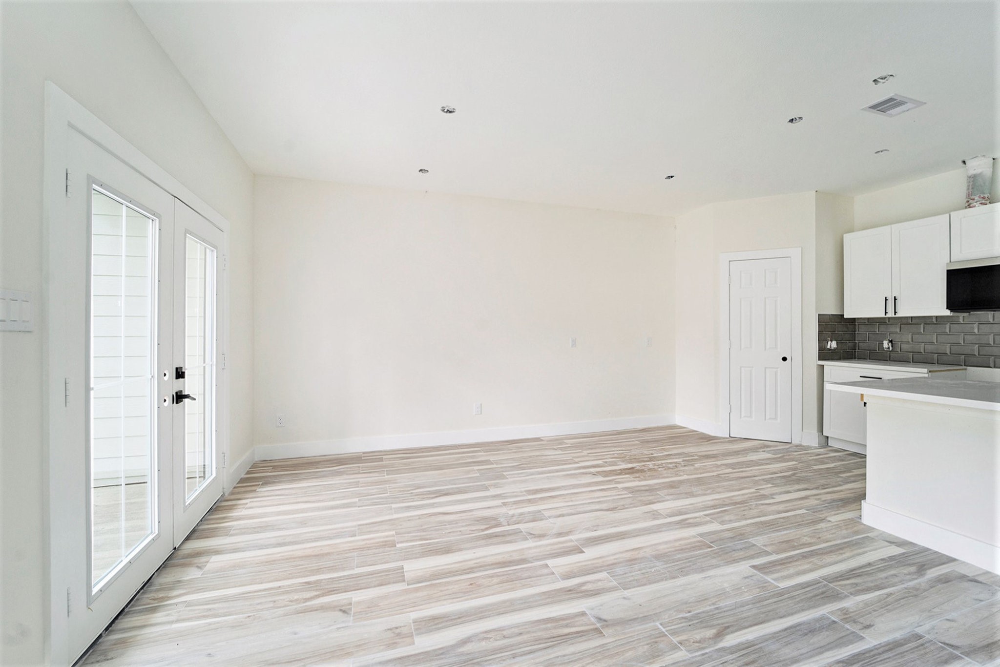 9807 Bamboo Road, Unit A Houston, TX 77041 - Photo 17 of 37 a view of a kitchen with wooden floor and a sink