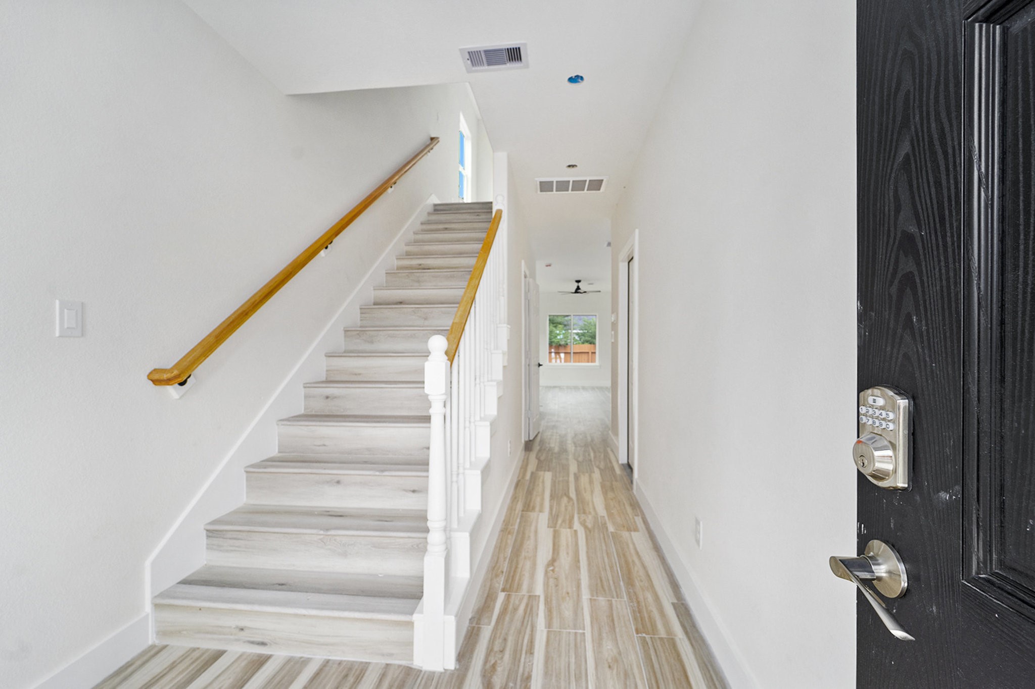 9807 Bamboo Road, Unit A Houston, TX 77041 - Photo 5 of 37 a view of staircase with white walls