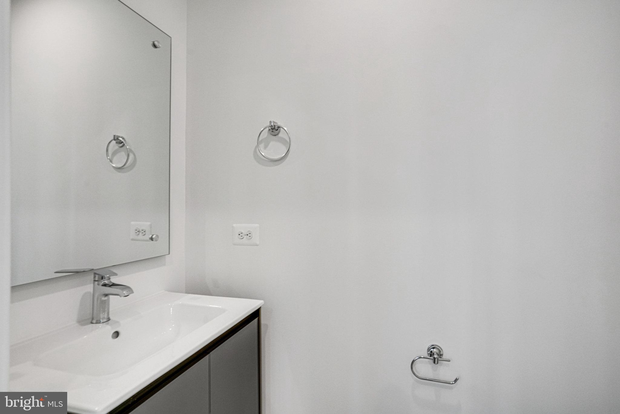 2058 Tysons Ridgeline Road Falls Church, VA 22043 - Photo 12 of 48 a bathroom with a sink and vanity