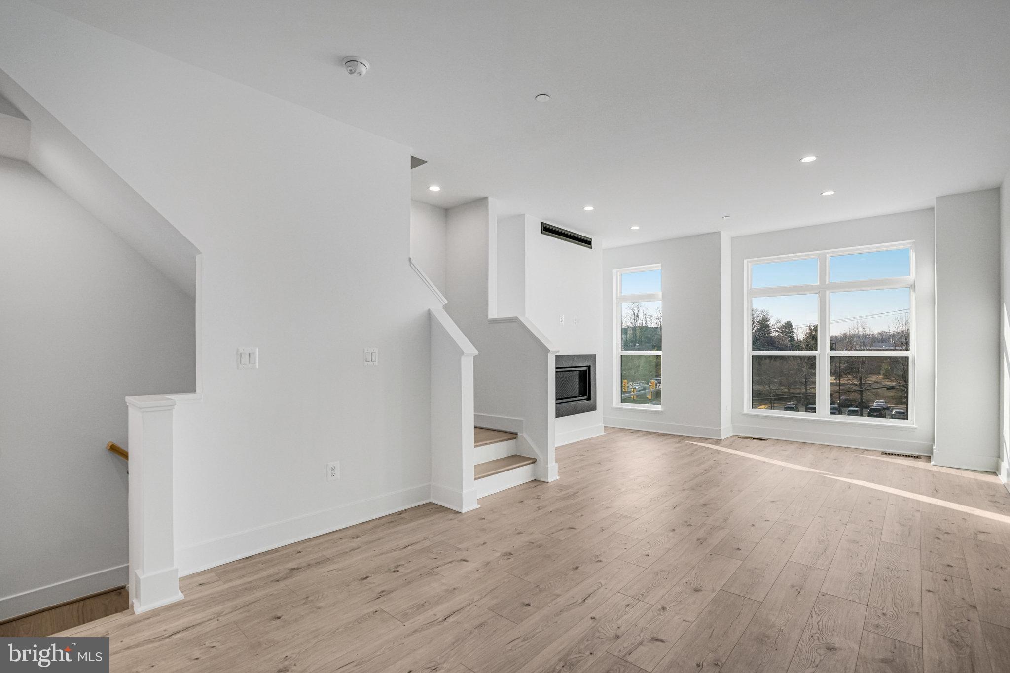2058 Tysons Ridgeline Road Falls Church, VA 22043 - Photo 13 of 48 an empty room with wooden floor and windows