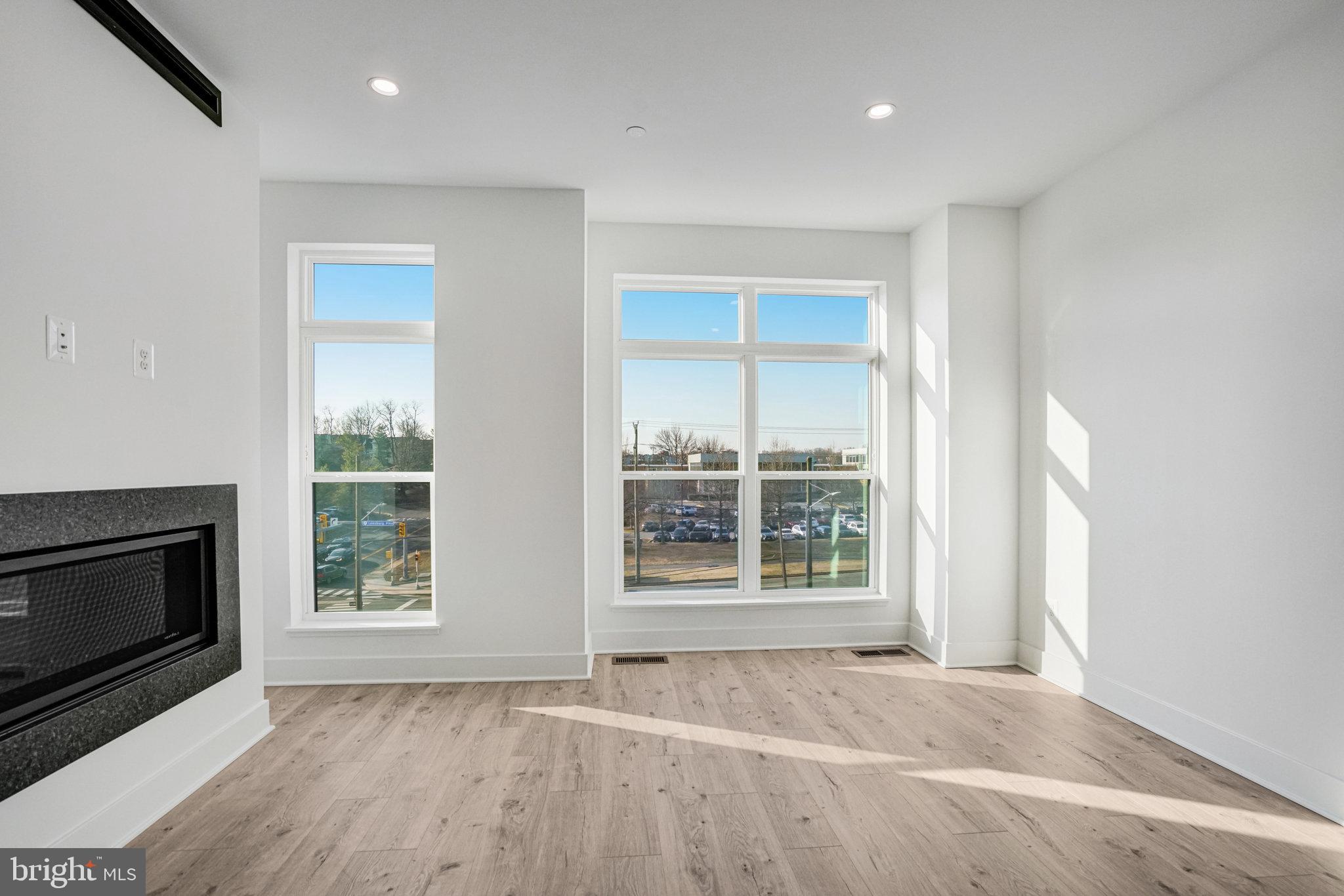 2058 Tysons Ridgeline Road Falls Church, VA 22043 - Photo 18 of 48 an empty room with wooden floor and a window