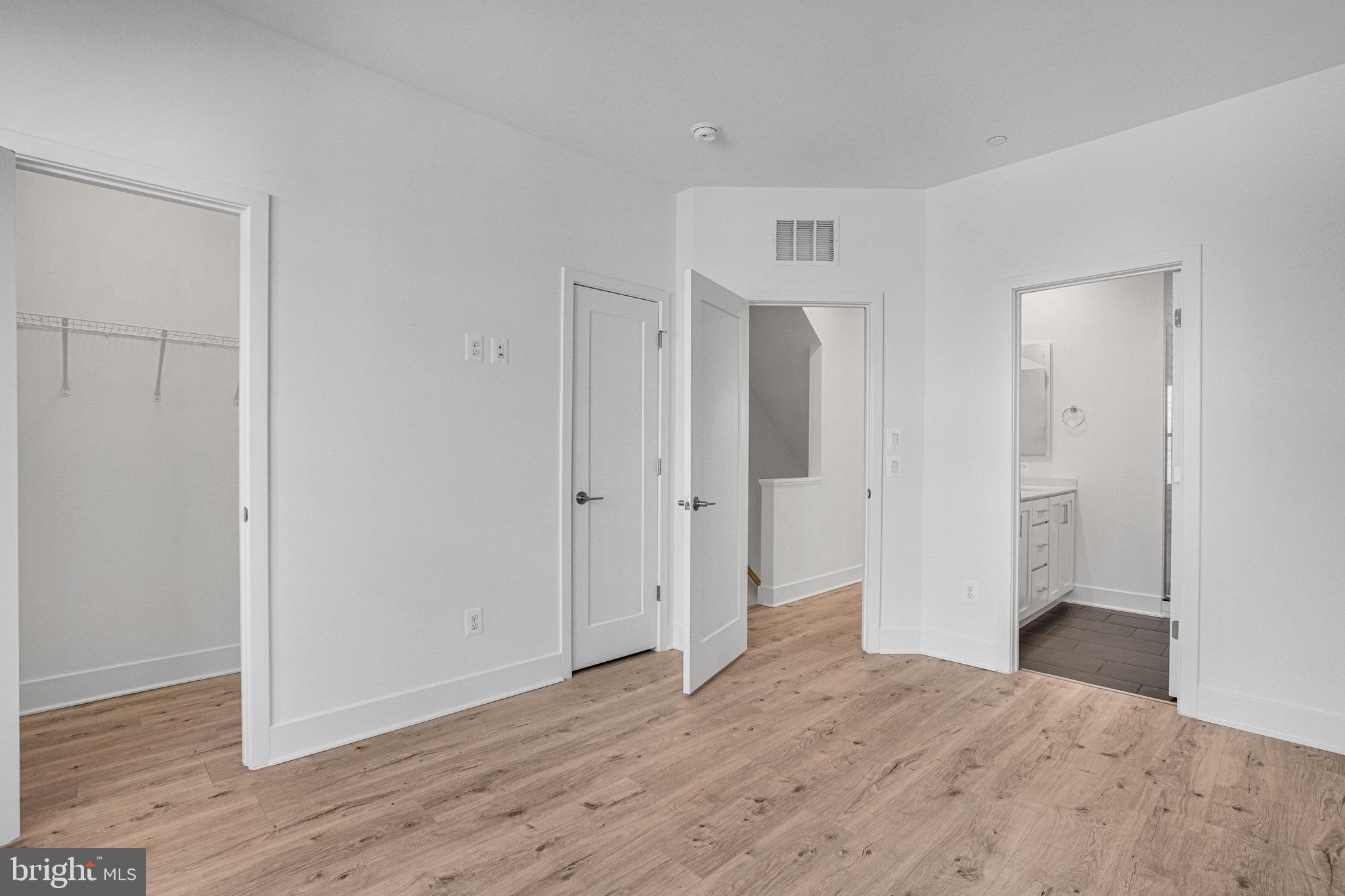2058 Tysons Ridgeline Road Falls Church, VA 22043 - Photo 22 of 48 a view of empty room with wooden floor