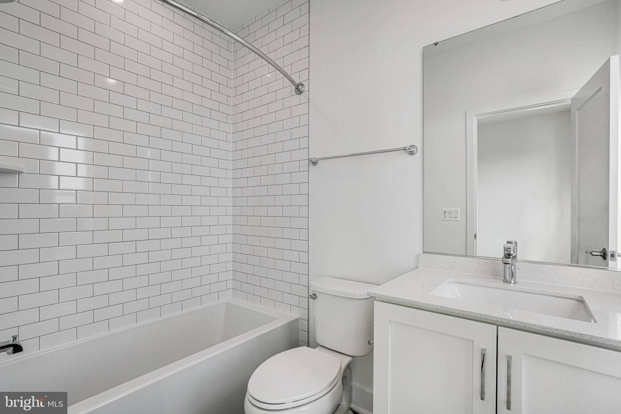 2058 Tysons Ridgeline Road Falls Church, VA 22043 - Photo 28 of 48 a bathroom with a sink toilet and shower