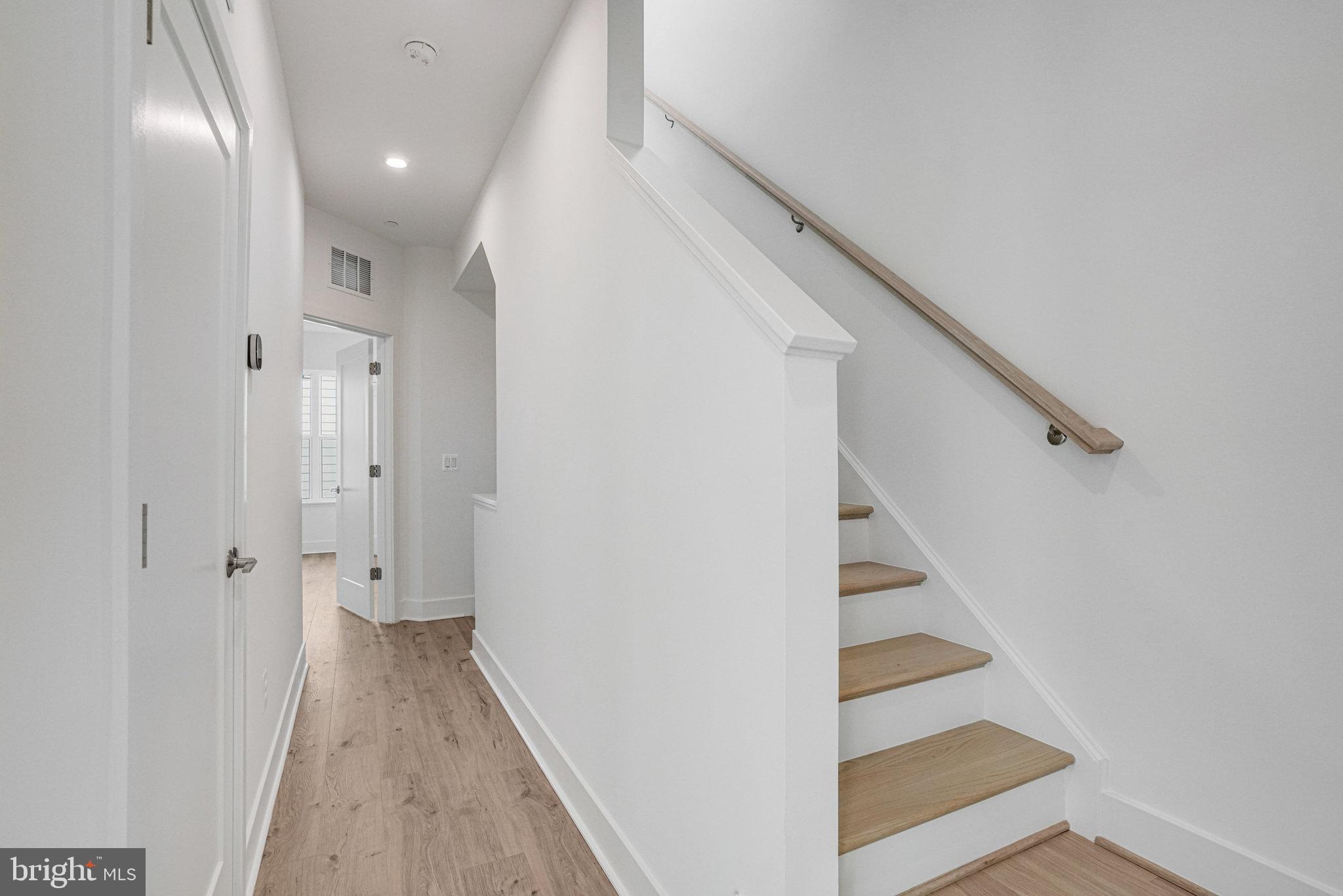 2058 Tysons Ridgeline Road Falls Church, VA 22043 - Photo 29 of 48 a view of a hallway with wooden floor and entryway