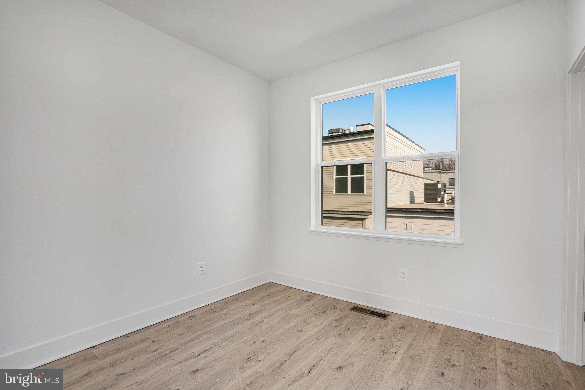 2058 Tysons Ridgeline Road Falls Church, VA 22043 - Photo 34 of 48 a big room with wooden floor and windows