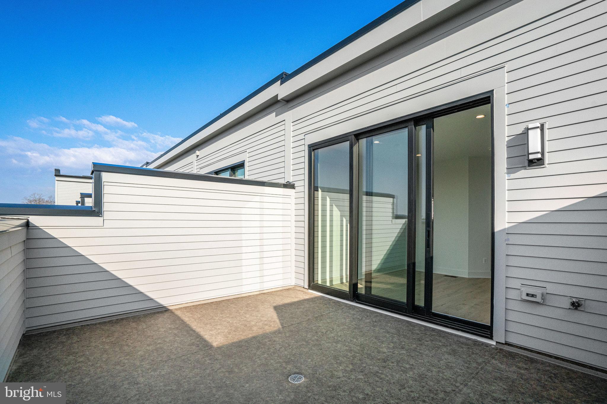 2058 Tysons Ridgeline Road Falls Church, VA 22043 - Photo 38 of 48 a view of a backyard with garage