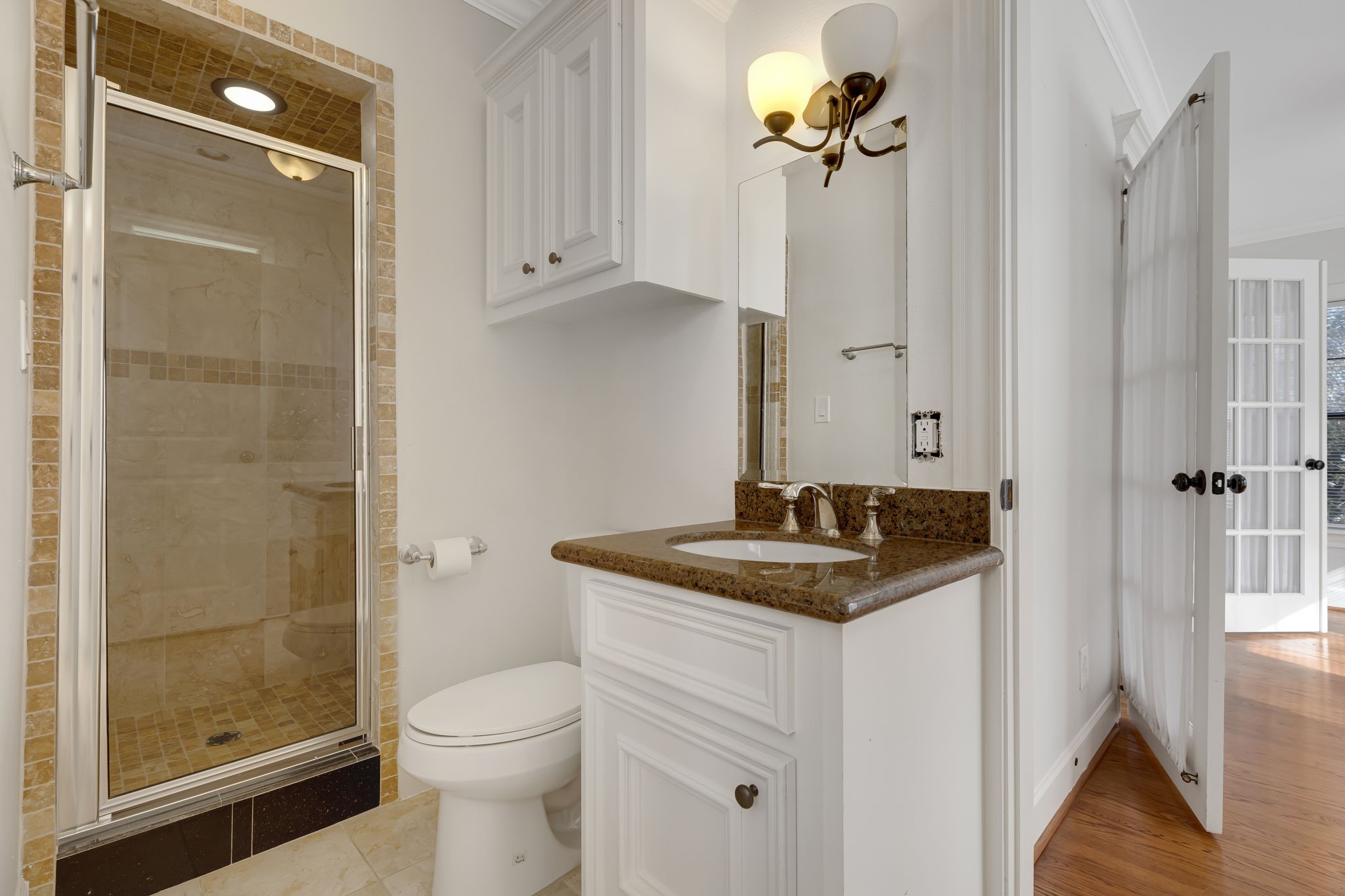 2306 Blodgett Street, Unit 2 Houston, TX 77004 - Photo 10 of 12 a bathroom with a granite countertop sink a toilet and shower