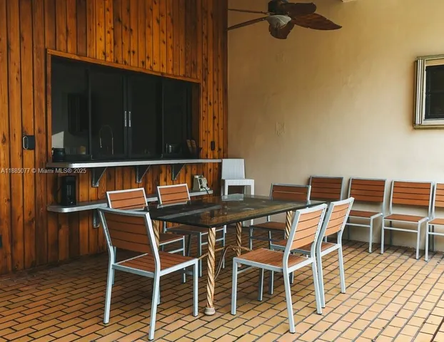 a view of a chairs and table in the balcony