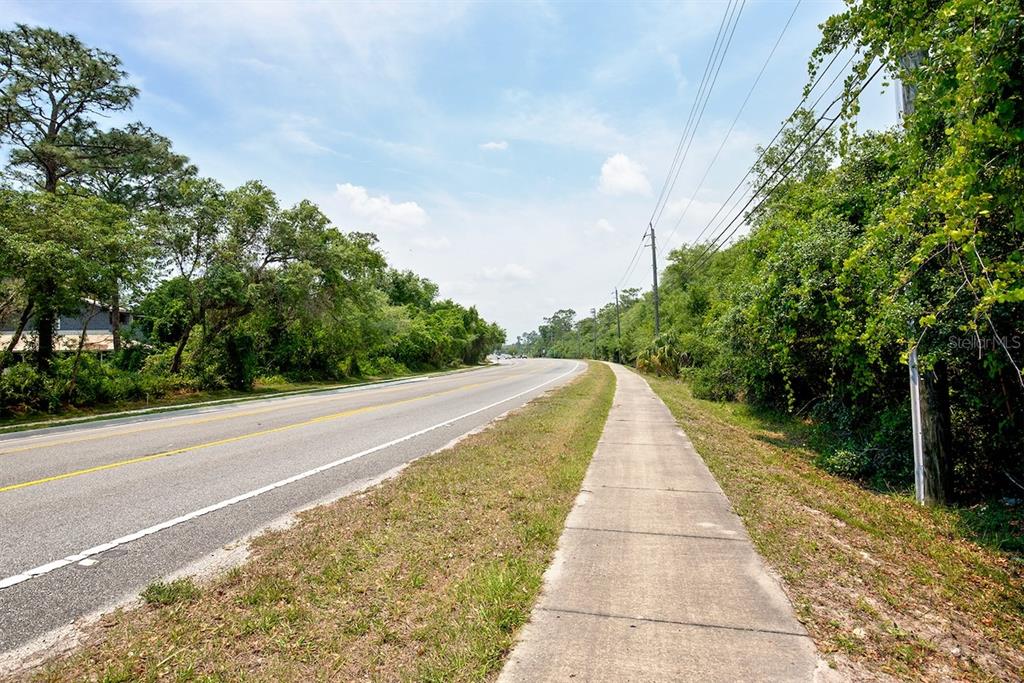 Stevens Street Chuluota, FL 32766 - Photo 9 of 16 a view of street with a yard