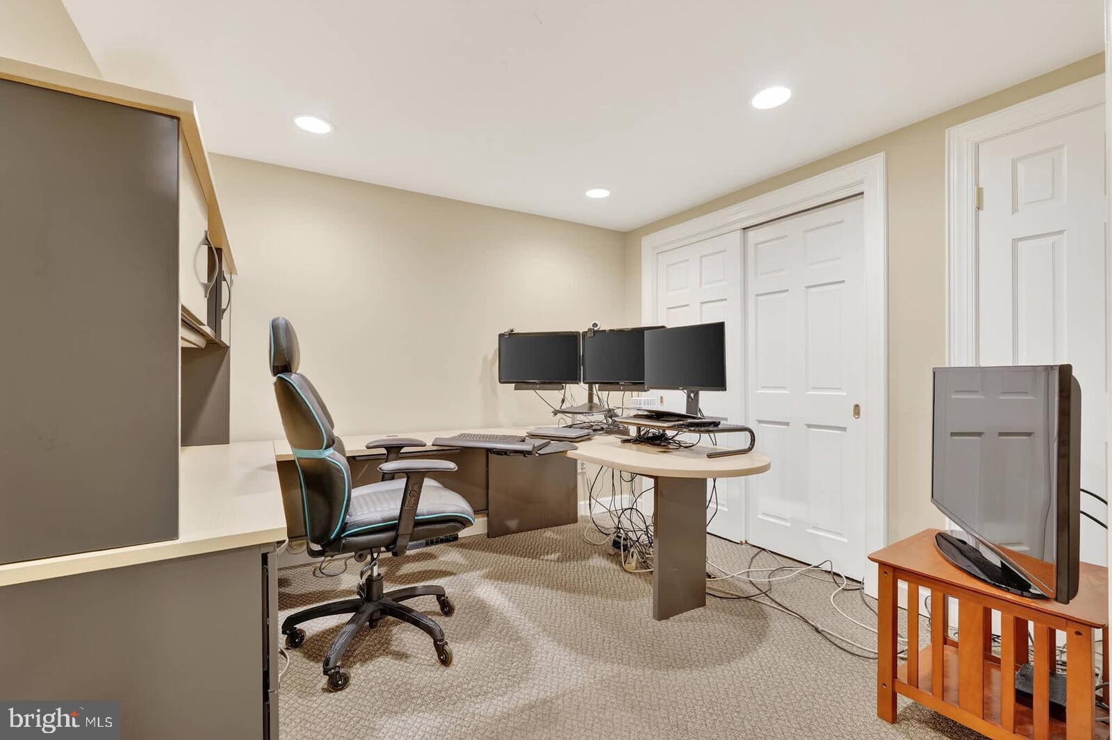 2108 Merrifields Drive Silver Spring, MD 20906 - Photo 48 of 69 a view of a workspace with furniture and a flat screen tv