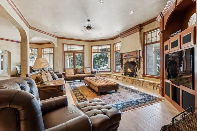 a living room with furniture and a fireplace