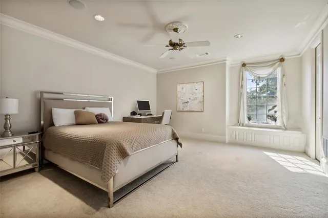 a bedroom with bed and window