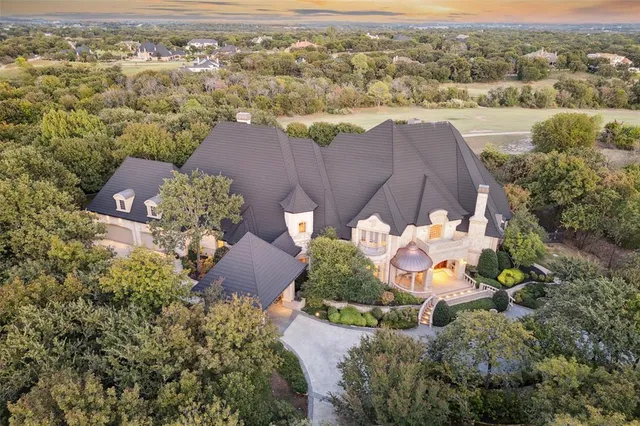 an aerial view of a house with a garden