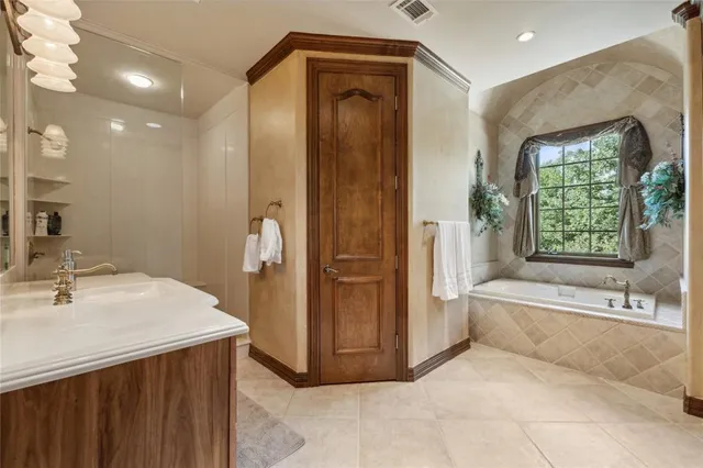 a bathroom with a bathtub and a sink
